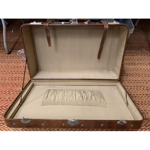 249 - A LARGE VINTAGE BROWN LEATHER SUITCASE WITH CHROME FITTINGS