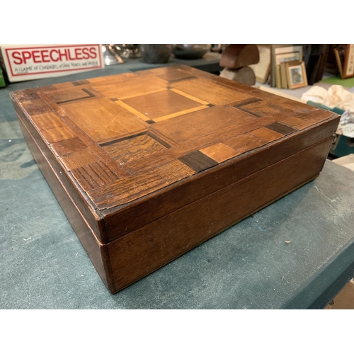 257 - A WOODEN BOX WITH INLAID TOP