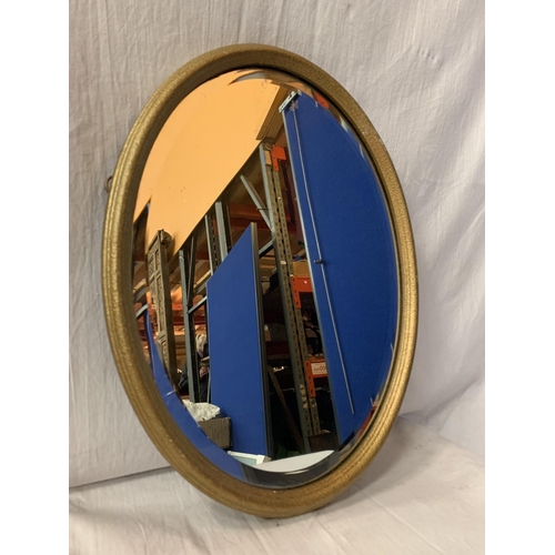 271 - A GILT FRAMED OVAL MIRROR (44 X 34 CMS)