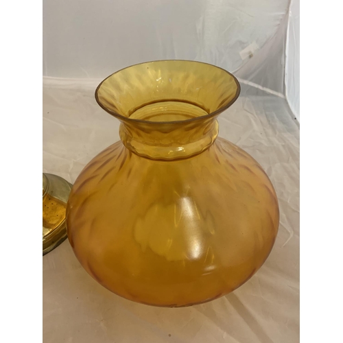 167 - A LARGE BRASS OIL LAMP WITH CLEAR GLASS CHIMNEY AND SHADE AND AN AMBER GLASS SHADE