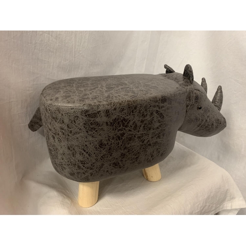 55 - A CHILD'S FAUX FUR FOOTSTOOL IN THE FORM OF A RHINO
