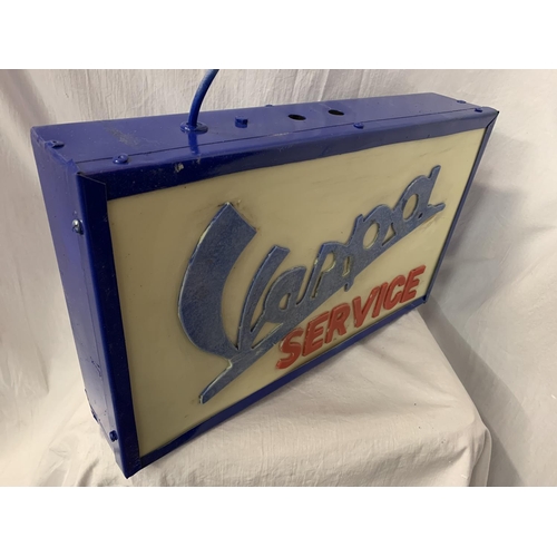 58 - AN ILLUMINATED 'VESPA' SIGN