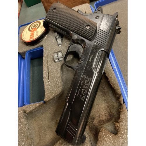 73 - A COLT GOVERNMENT 1911 A1 AIR GUN WITH PELLETS INCLUDED