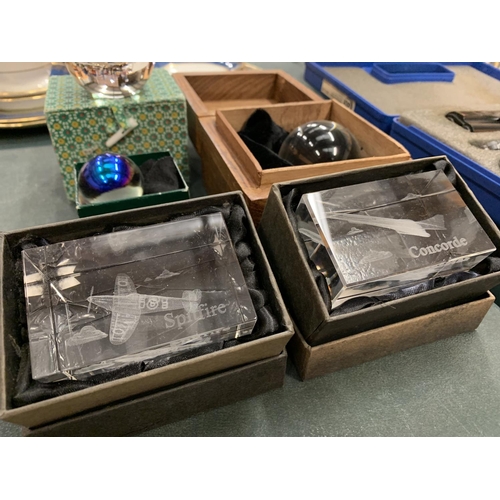 75 - THREE BOXED CRYSTAL BALLS AND TWO LIMITED EDITION PAPER WEIGHTS: 'SPITFIRE' AND 'CONCORDE'