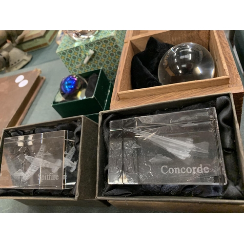 75 - THREE BOXED CRYSTAL BALLS AND TWO LIMITED EDITION PAPER WEIGHTS: 'SPITFIRE' AND 'CONCORDE'