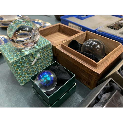 75 - THREE BOXED CRYSTAL BALLS AND TWO LIMITED EDITION PAPER WEIGHTS: 'SPITFIRE' AND 'CONCORDE'