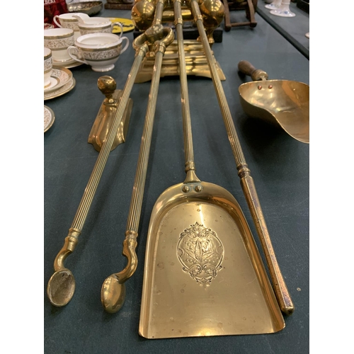 88 - A BRASS COMPANION SET AND FIREDOGS TO INCLUDE A SHOVEL ETC