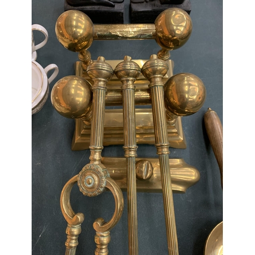 88 - A BRASS COMPANION SET AND FIREDOGS TO INCLUDE A SHOVEL ETC