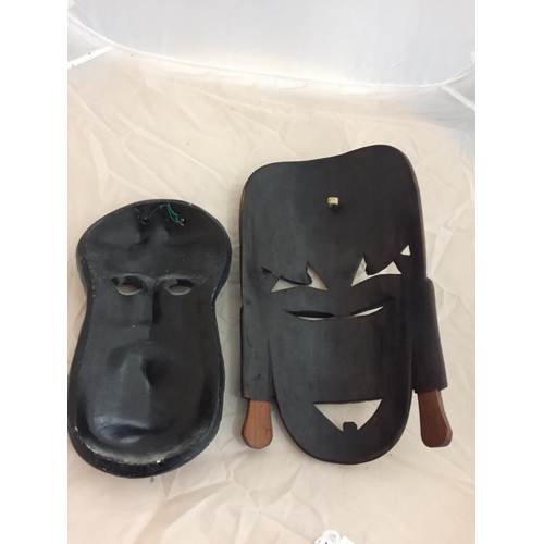 165 - A HARDWOOD CARVED TRIBAL MASK AND A GREEK CERAMIC MASK OF ZEUS
