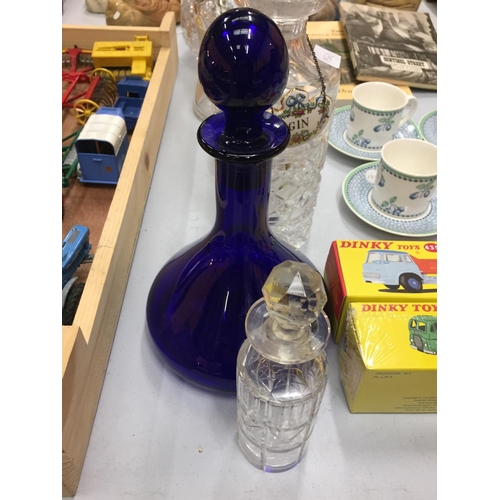 199 - FIVE GLASS DECANTERS WITH THREE BONE CHINA SPIRIT LABELS AND A SMALL CUT GLASS BOTTLE WITH STOPPER