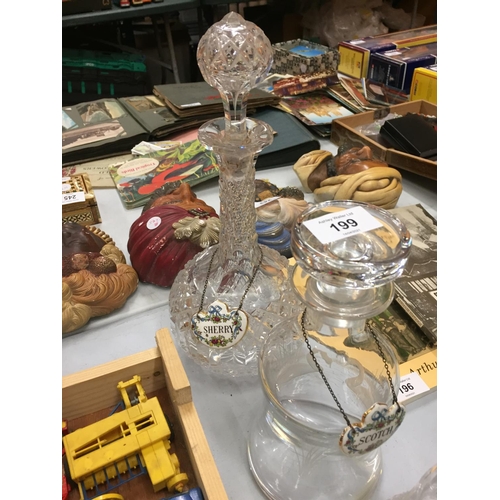 199 - FIVE GLASS DECANTERS WITH THREE BONE CHINA SPIRIT LABELS AND A SMALL CUT GLASS BOTTLE WITH STOPPER