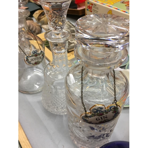 199 - FIVE GLASS DECANTERS WITH THREE BONE CHINA SPIRIT LABELS AND A SMALL CUT GLASS BOTTLE WITH STOPPER