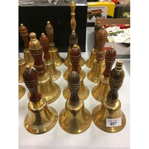 207 - A LARGE COLLECTION OF BRASS HAND BELLS