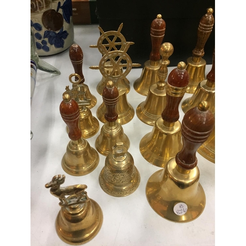 207 - A LARGE COLLECTION OF BRASS HAND BELLS