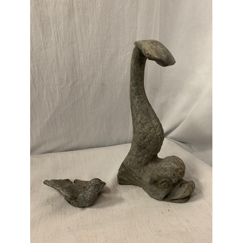 153 - A LEAD DOOR STOP IN THE FORM OF A MYTHICAL FISH AND A LEAD BIRD IN FLIGHT - FISH H:26CM BIRD L:12CM