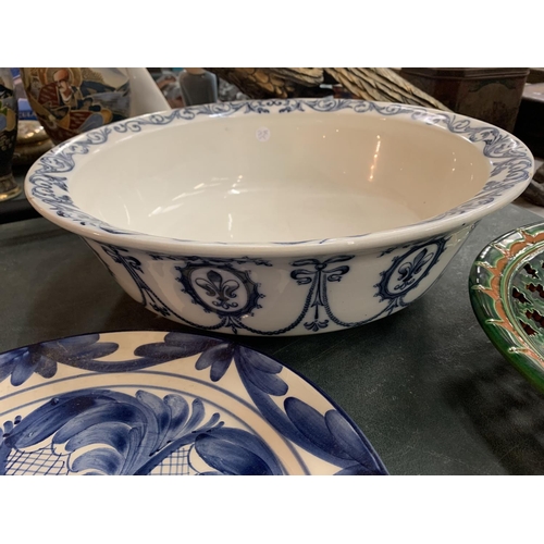 156 - A COLLECTION OF LARGE CERAMIC BOWLS AND A BLUE AND WHITE PLATE