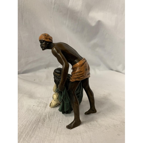 18 - A BERGMAN STYLE COLD PAINTED BRONZE OF A NATIVE AND A GIRL HEIGHT APPROXIMATELY 12.5CM