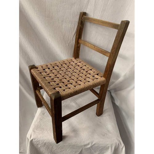 45 - A CHILD'S RUSH SEATED WOODEN CHAIR