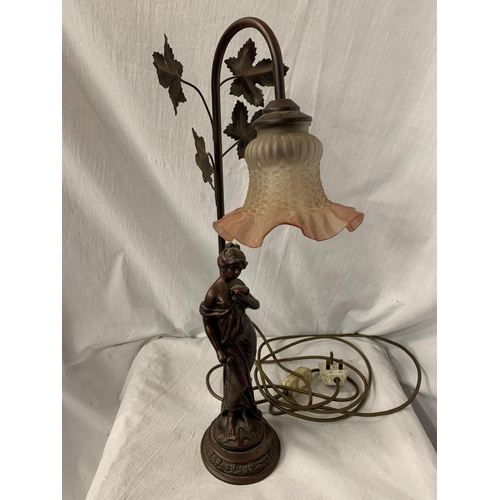 48 - A COMPOSITE TABLE LAMP IN THE FORM OF A GRECIAN STYLE LADY WITH PINK TINGED FLUTED SHADE