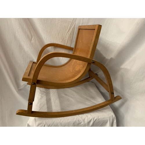 50 - A CHILD'S WOODEN SCANDINAVIAN STYLE ROCKING CHAIR