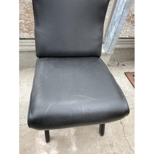 2251 - A BLACK LEATHER EFFECT FIRESIDE CHAIR