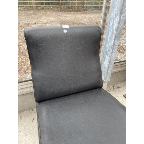 2251 - A BLACK LEATHER EFFECT FIRESIDE CHAIR