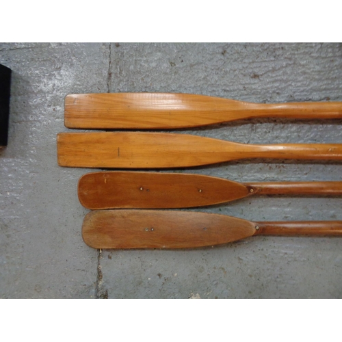 280 - TWO PAIRS OF VINTAGE WOODEN OARS.
ONE SET BEING 74