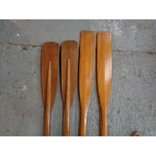 280 - TWO PAIRS OF VINTAGE WOODEN OARS.
ONE SET BEING 74