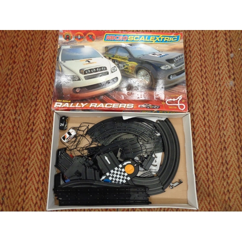 303 - A CARRERA GO111 1:43 SCALE SLOT RACING SYSTEM 'JAMES BOND CASINO ROYALE' AND A BOXED SCALEXTRIC SET