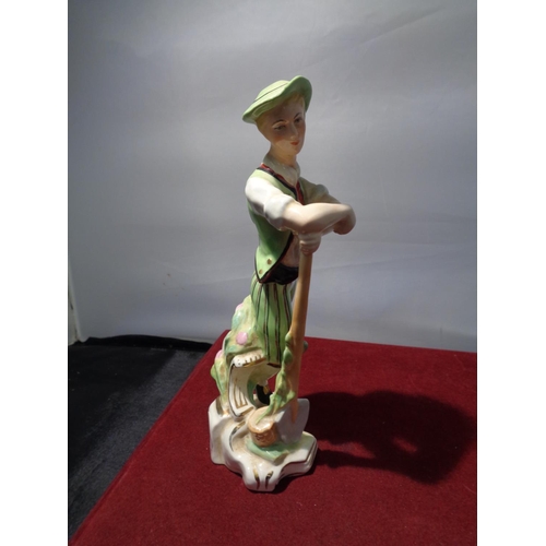 729 - A WEDGWOOD FIGURINE OF A GARDNER