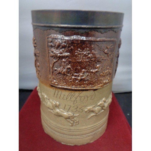 757 - A VERY LARGE LAMBETH WARE TANKARD INSCRIBED MILLFORD 1735 WITH A WHITE METAL PROBABLY SILVER RIM