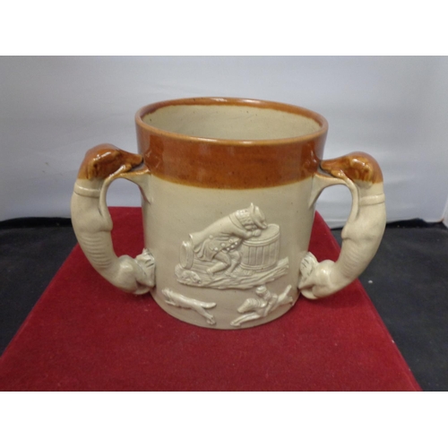 758 - A THREE HANDLED LAMBETH WARE TANKARD