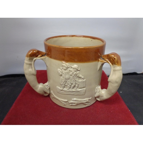 758 - A THREE HANDLED LAMBETH WARE TANKARD