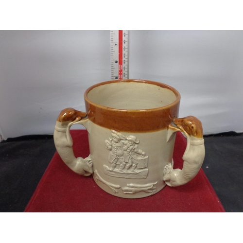 758 - A THREE HANDLED LAMBETH WARE TANKARD