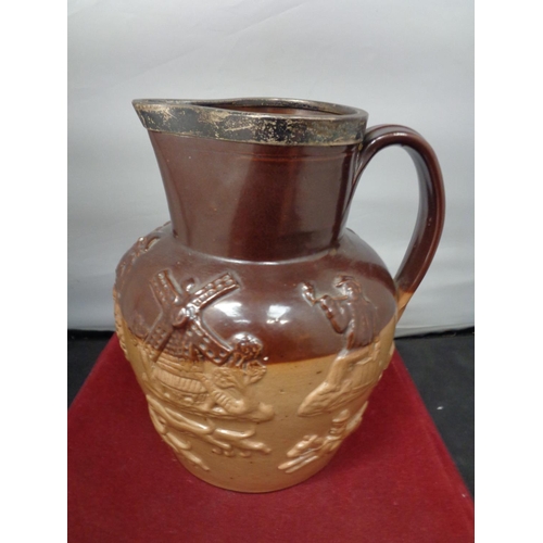 759 - A LAMBETH WARE JUG WITH A HALLMARKED BIRMINGHAM SILVER RIM