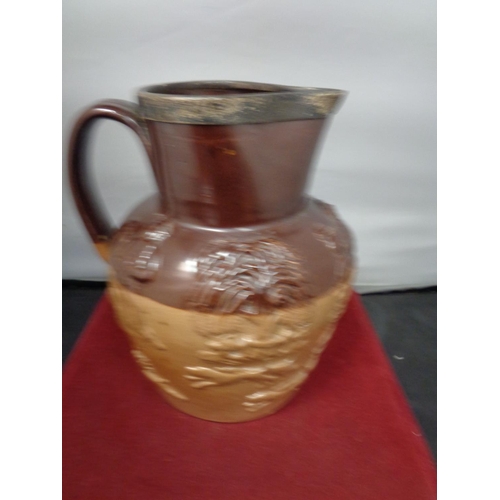 759 - A LAMBETH WARE JUG WITH A HALLMARKED BIRMINGHAM SILVER RIM