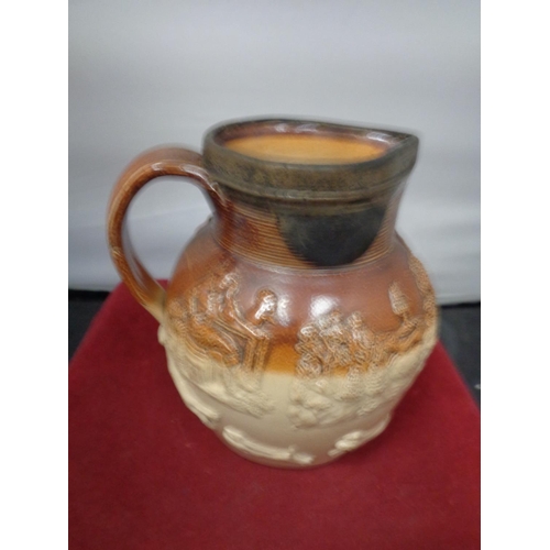 762 - A LAMBETH WARE JUG WITH A POSSIBLY SILVER RIM