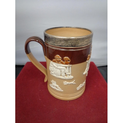 763 - A LAMBETH WARE TANKARD WITH A HALLMARKED LONDON SILVER RIM