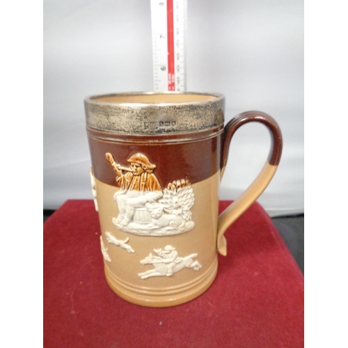 763 - A LAMBETH WARE TANKARD WITH A HALLMARKED LONDON SILVER RIM