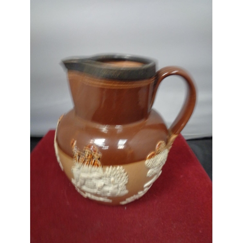 764 - A LAMBETH WARE JUG WITH A HALLMARKED CHESTER SILVER RIM