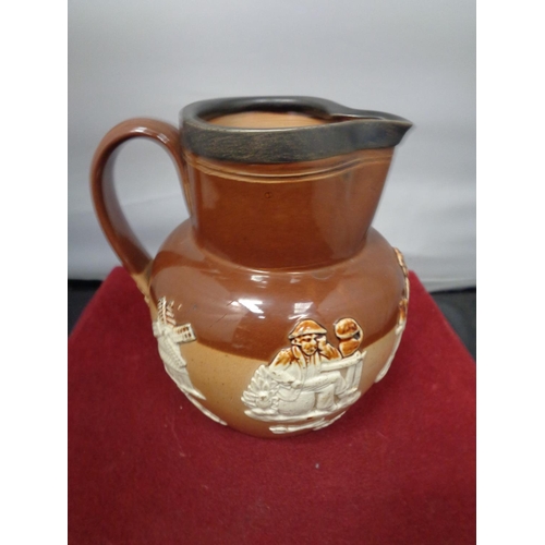 764 - A LAMBETH WARE JUG WITH A HALLMARKED CHESTER SILVER RIM