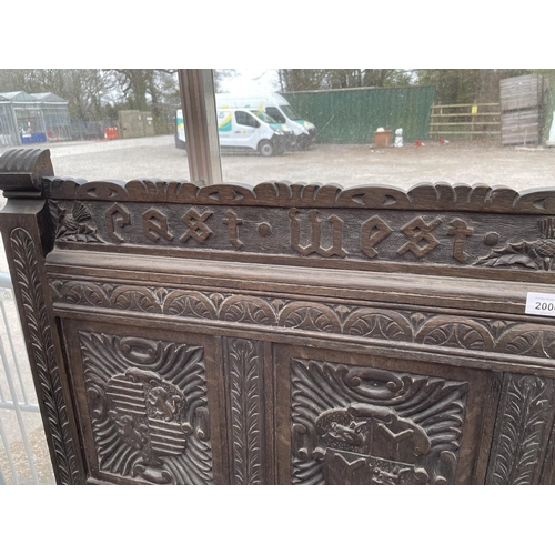 2006 - A VICTORIAN OAK SETTLE WITH TWELVE CARVED PANELS DEPICTING VARIOUS CRESTS AND MOTTO 'EAST, WEST, HOM... 