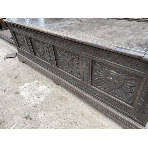 2006 - A VICTORIAN OAK SETTLE WITH TWELVE CARVED PANELS DEPICTING VARIOUS CRESTS AND MOTTO 'EAST, WEST, HOM... 