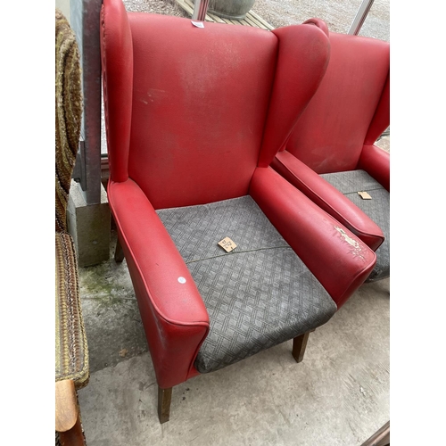 2023 - A PAIR OF RED LEATHERETTE PARKER KNOLL STYLE WINGED FIRESIDE CHAIRS