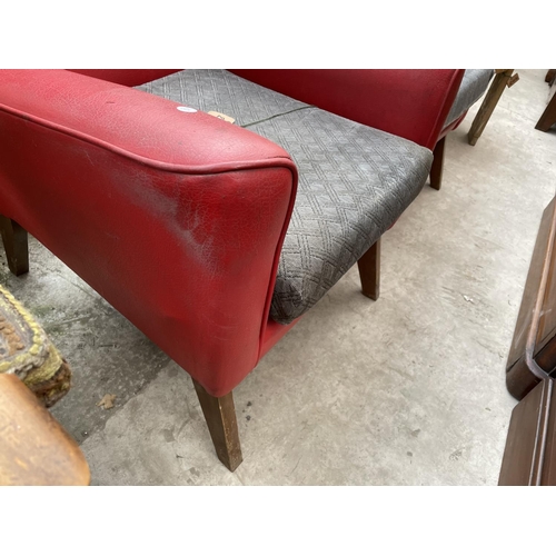 2023 - A PAIR OF RED LEATHERETTE PARKER KNOLL STYLE WINGED FIRESIDE CHAIRS