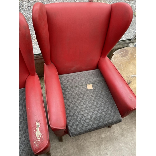 2023 - A PAIR OF RED LEATHERETTE PARKER KNOLL STYLE WINGED FIRESIDE CHAIRS