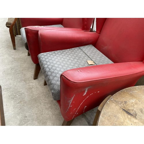 2023 - A PAIR OF RED LEATHERETTE PARKER KNOLL STYLE WINGED FIRESIDE CHAIRS