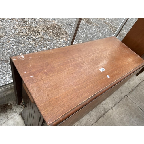 2038 - AN EARLY 20TH CENTURY OAK DROP LEAF TABLE WITH END DRAWERS AND CUPBOARD