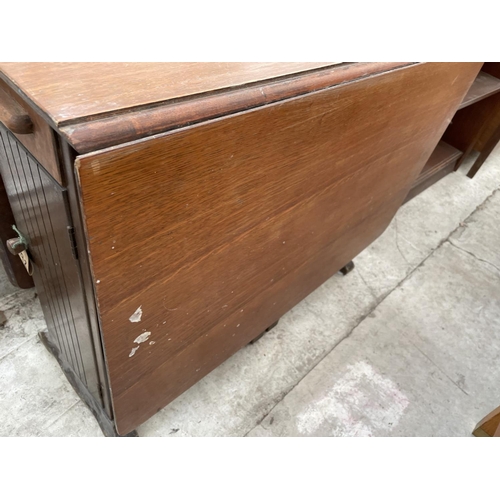 2038 - AN EARLY 20TH CENTURY OAK DROP LEAF TABLE WITH END DRAWERS AND CUPBOARD