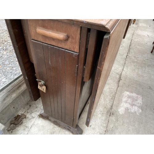 2038 - AN EARLY 20TH CENTURY OAK DROP LEAF TABLE WITH END DRAWERS AND CUPBOARD